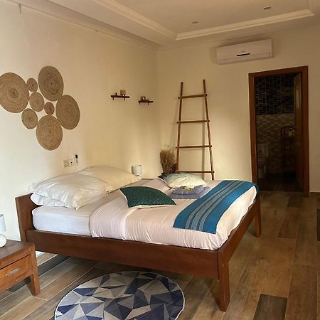L'Oasis Guesthouse Котону Екстер'єр фото