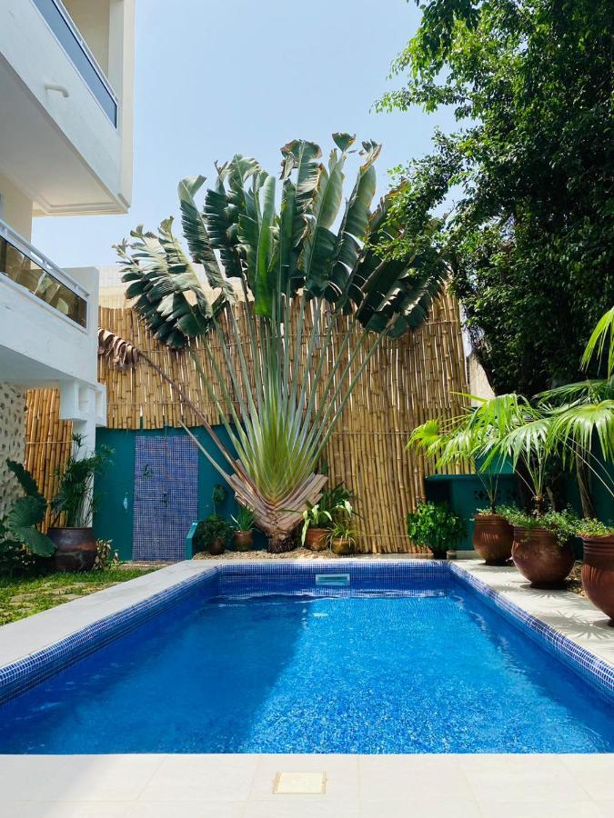 L'Oasis Guesthouse Котону Екстер'єр фото