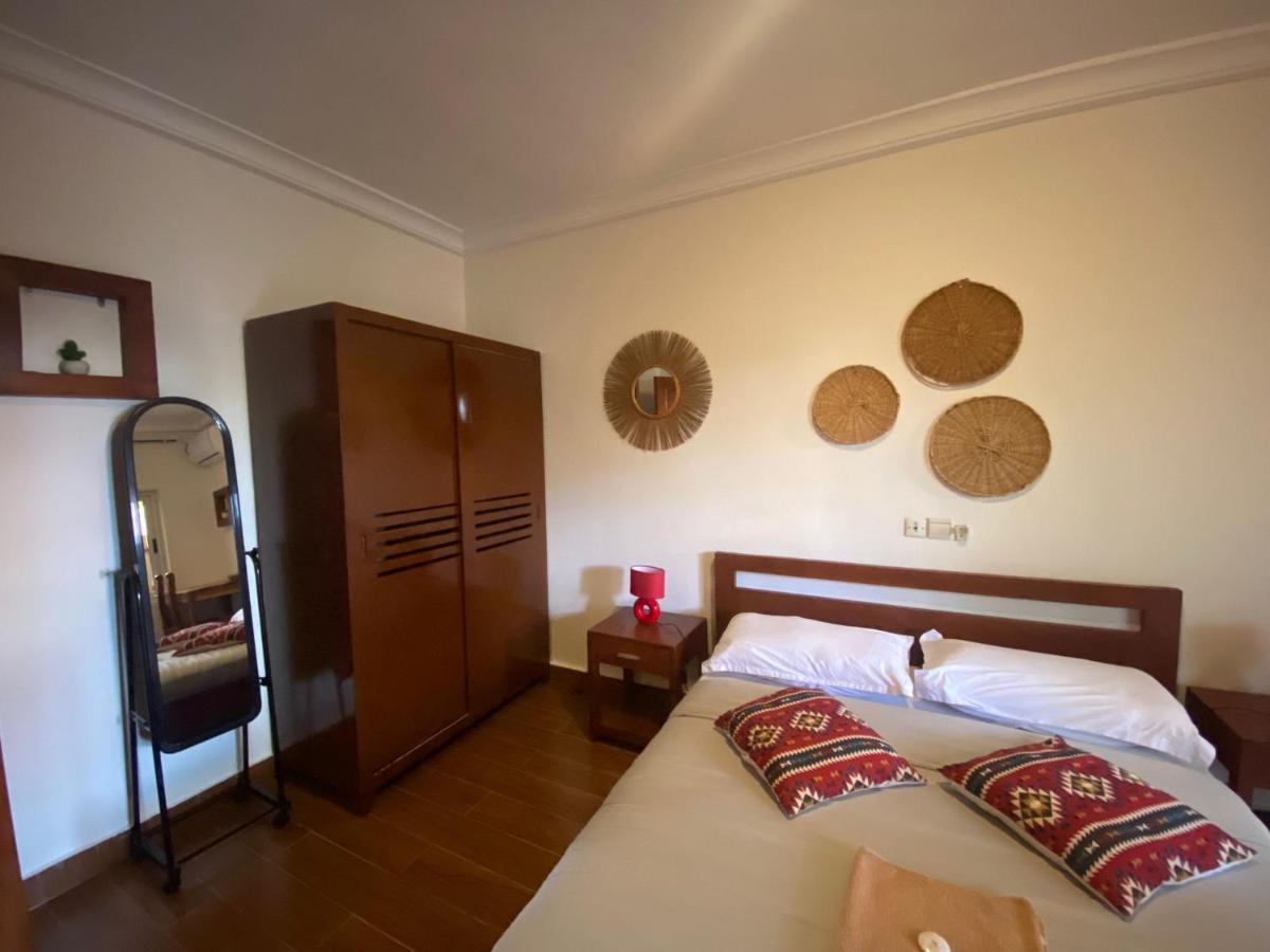 L'Oasis Guesthouse Котону Екстер'єр фото