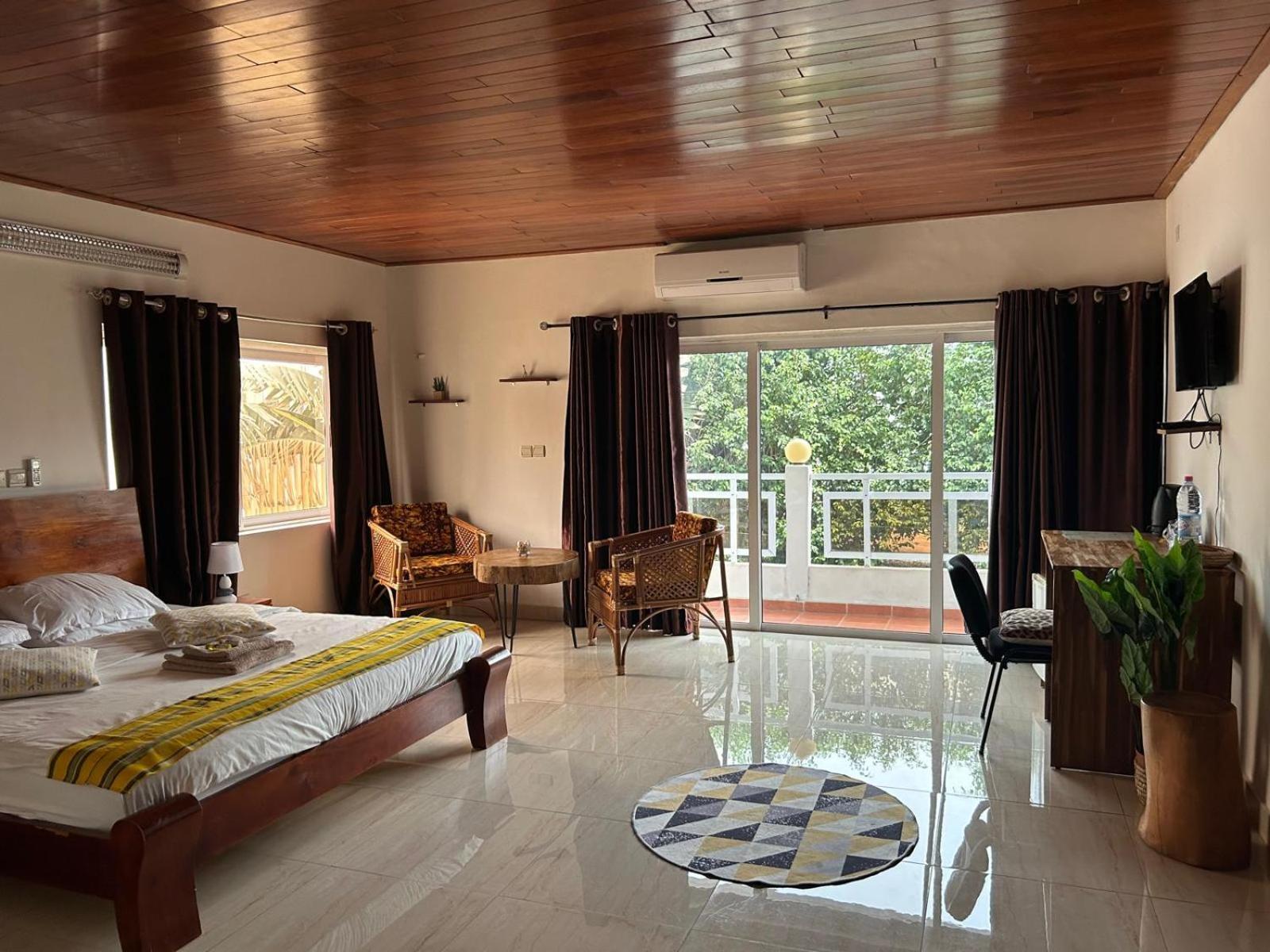 L'Oasis Guesthouse Котону Екстер'єр фото