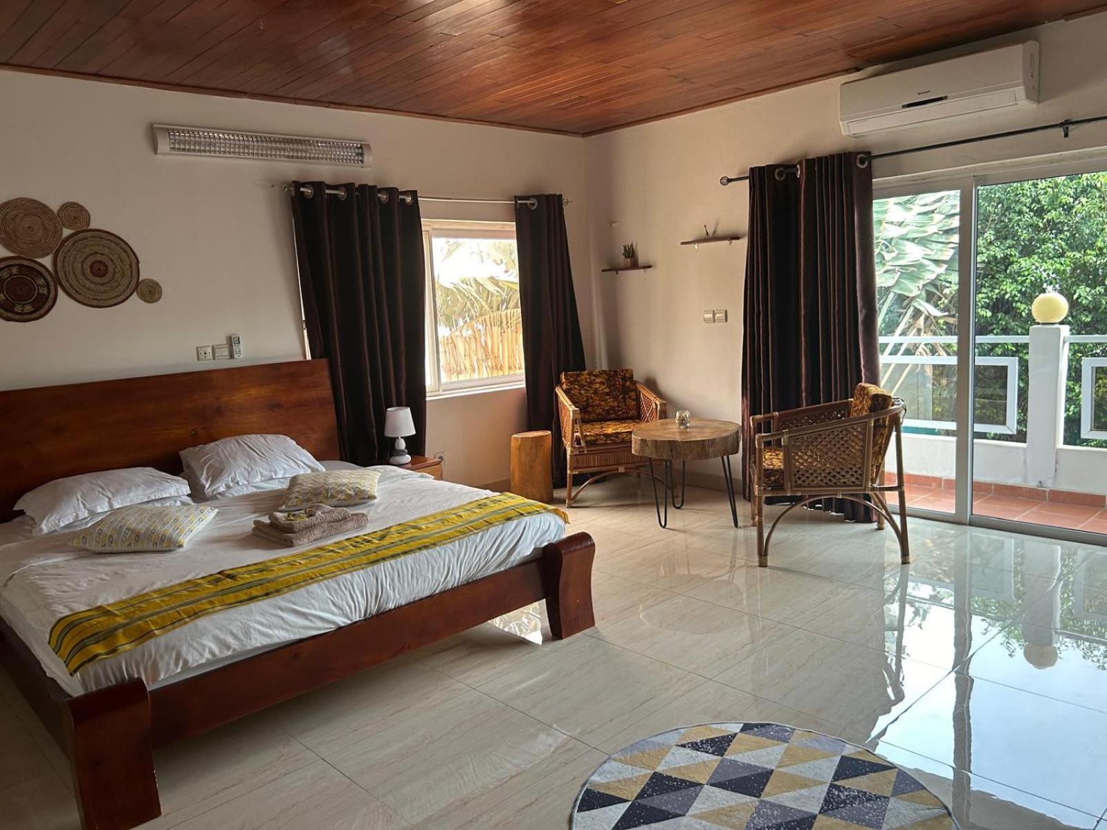 L'Oasis Guesthouse Котону Екстер'єр фото