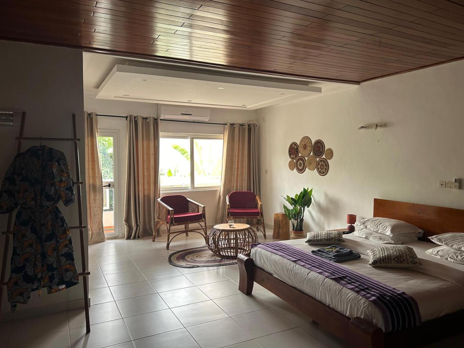 L'Oasis Guesthouse Котону Екстер'єр фото