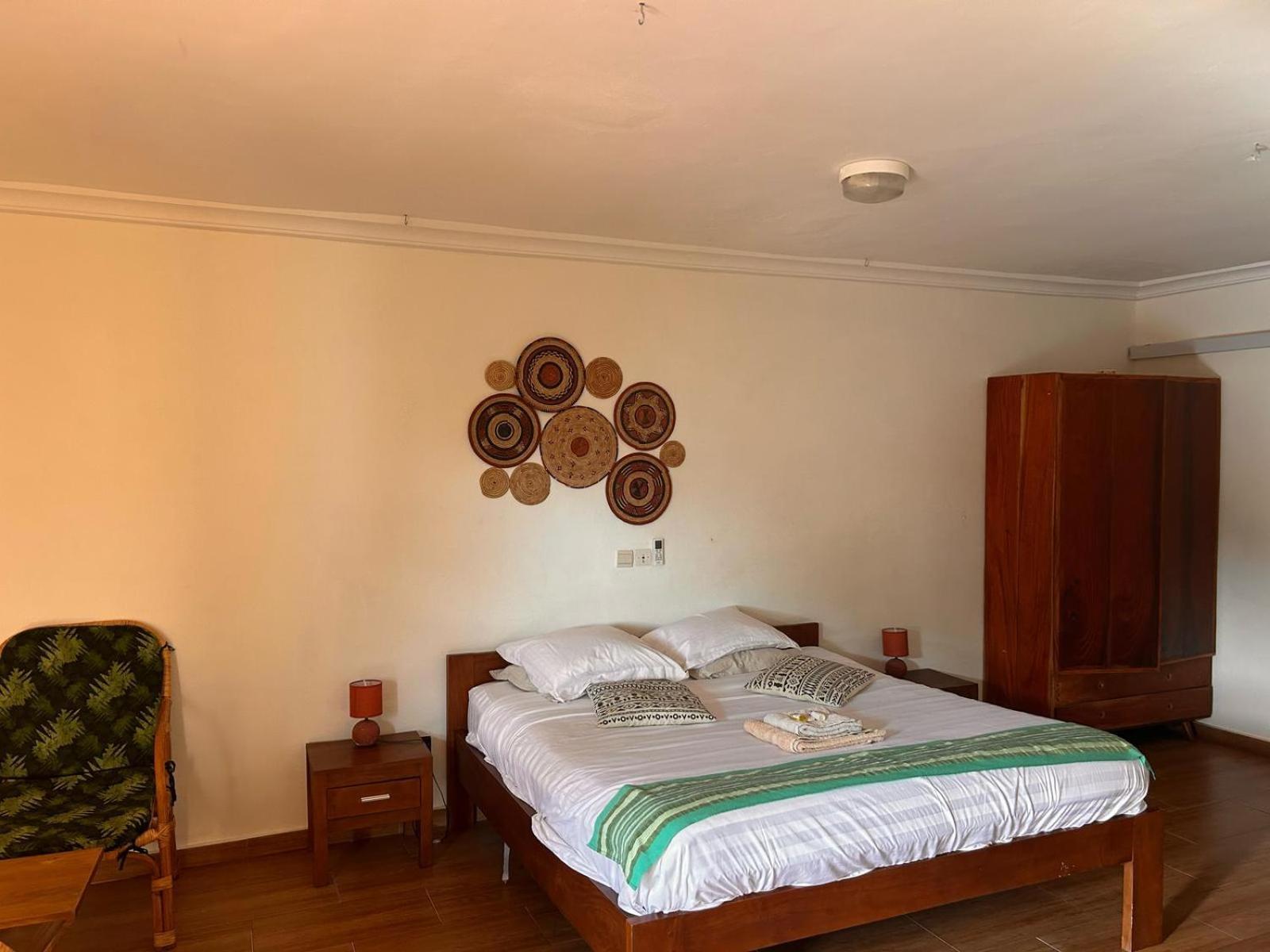 L'Oasis Guesthouse Котону Екстер'єр фото